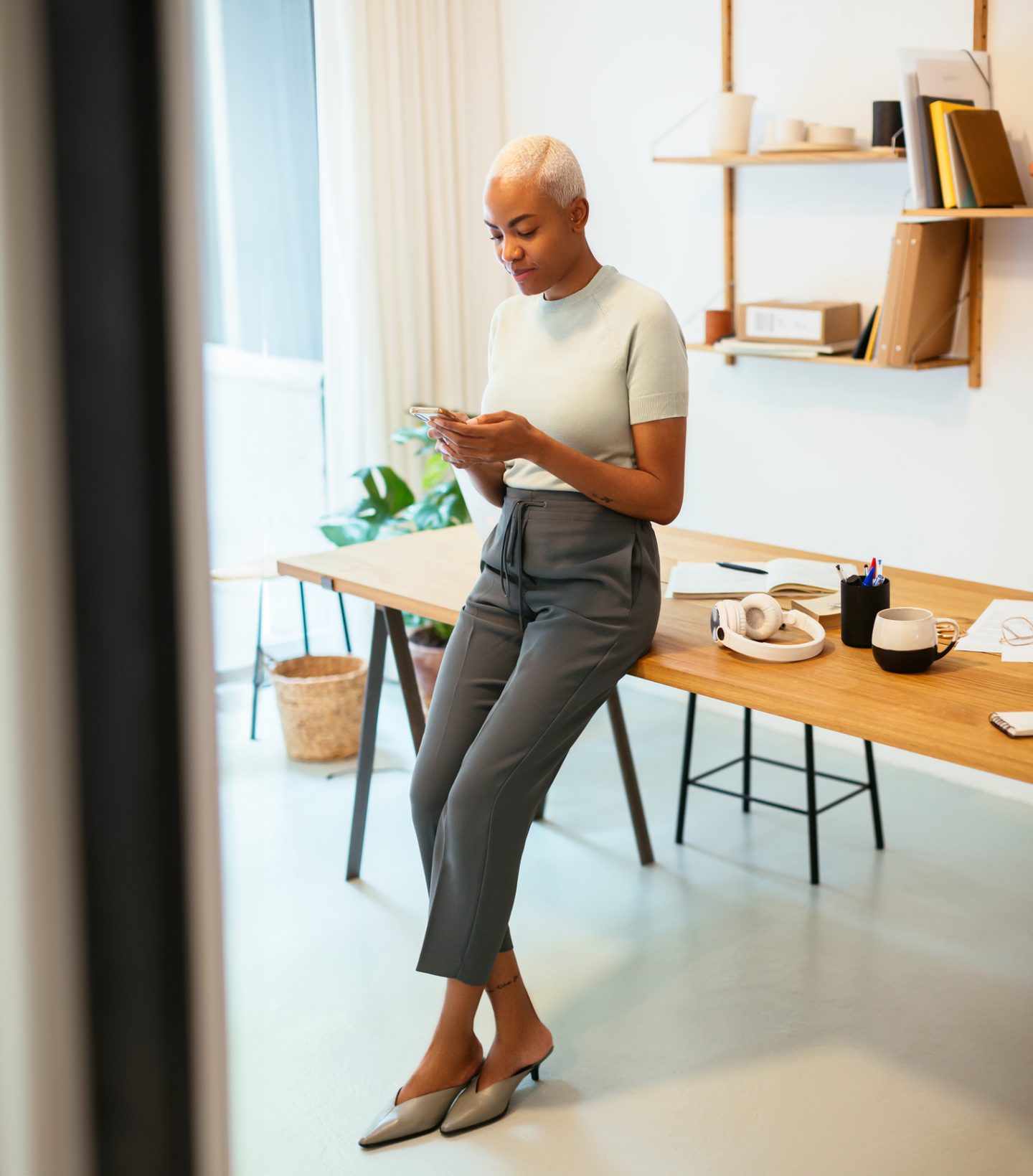 Woman on her phone in an office setting