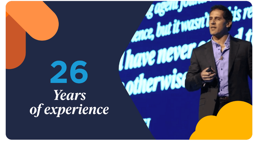 Bullhorn CEO Art Papas speaking at a conference alongside the text "26 Years of experience," illustrating why Bullhorn is the best recruiting agency software for the recruitment industry.