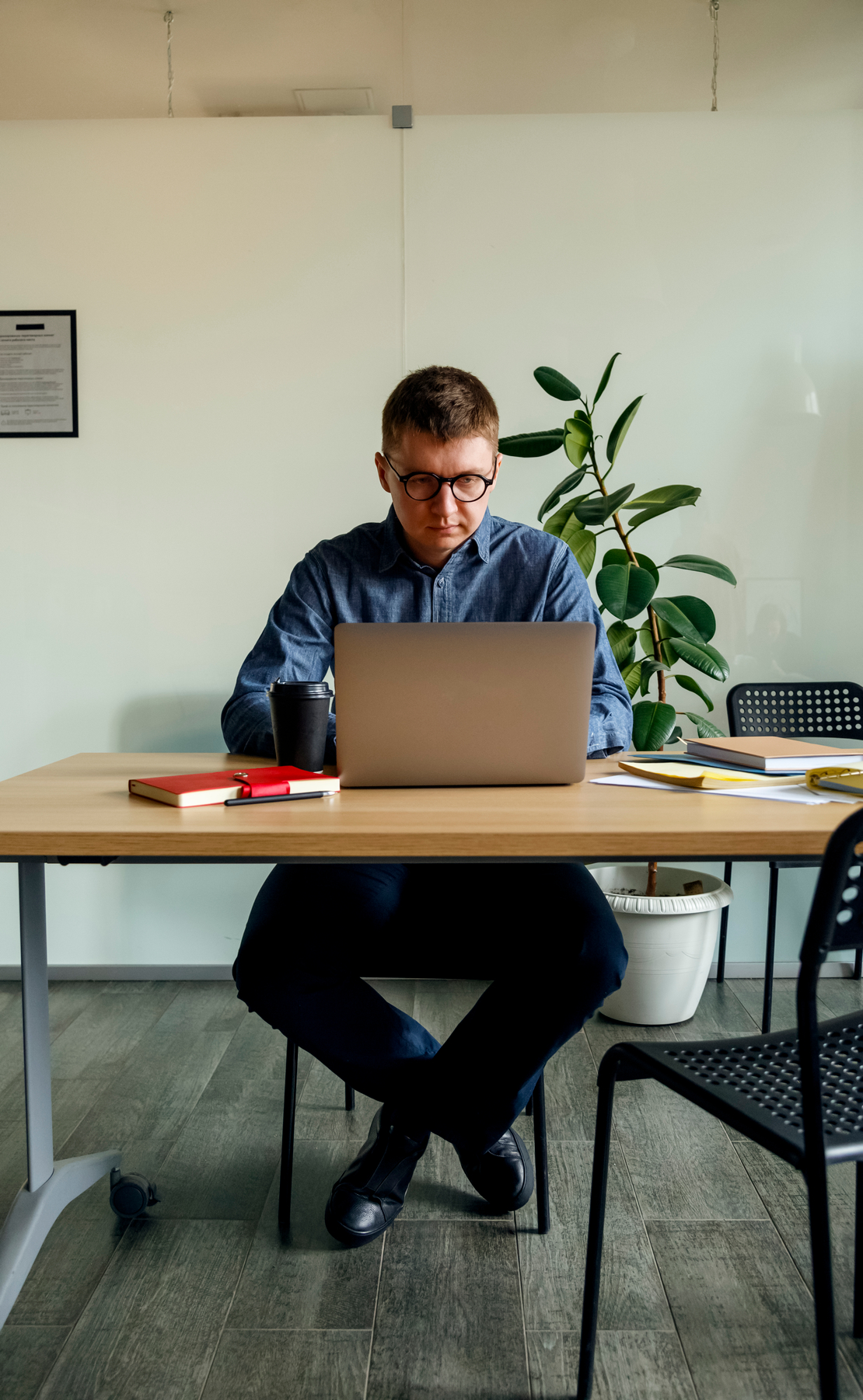 Footer Focused Man Working On Laptop In Office