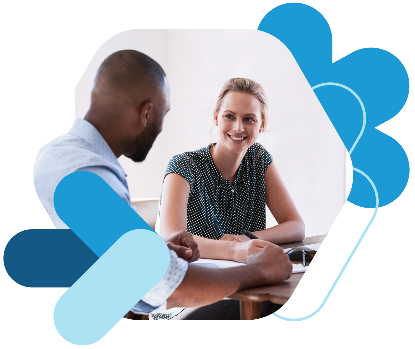 Two individuals at a desk having a conversation with bullhorn branded shapes surrounding