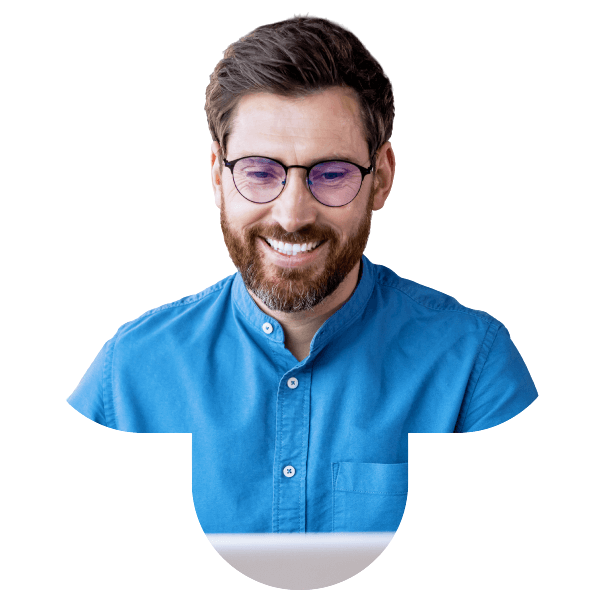 A man wearing glasses and a blue shirt smiles, symbolizing Bullhorn applicant tracking system software.