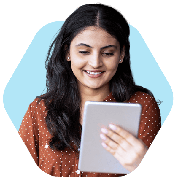 A woman using a tablet to explore top staffing software designed for small agencies.