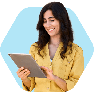 Woman using a tablet, representing a recruiter at a small agency managing work through staffing software for small agencies
